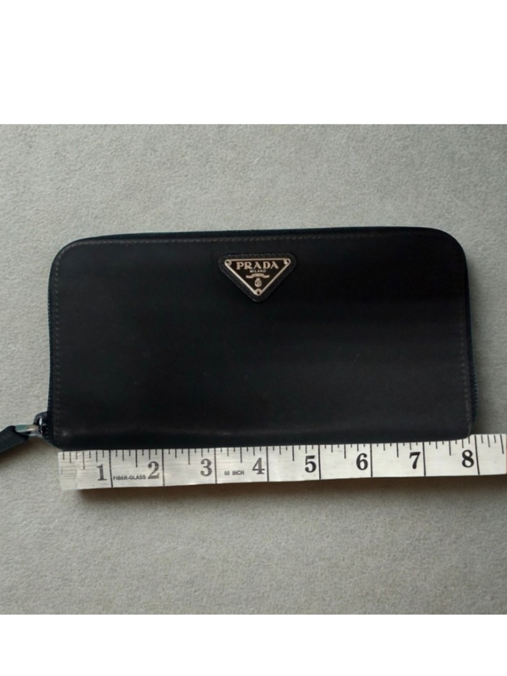 Prada black tessuto nylon & leather zip-around wallet enameled triangle logo.